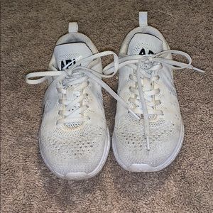 white APL tennis shoes